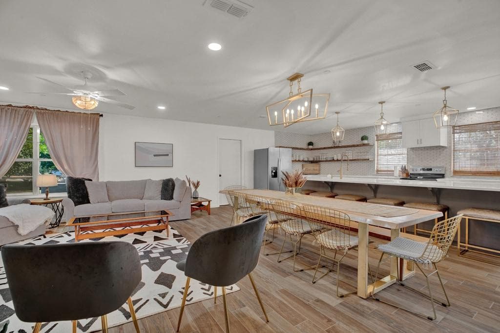 Open concept with seating for 6 at the island, seating for 10 at the custom dinning room table and a comfortable queen sleeper sofa in the living room.