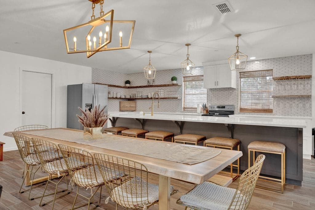 Welcome to Pecan Haus. Open Concept with a dinning room table for 10 and a large island that seats 6.